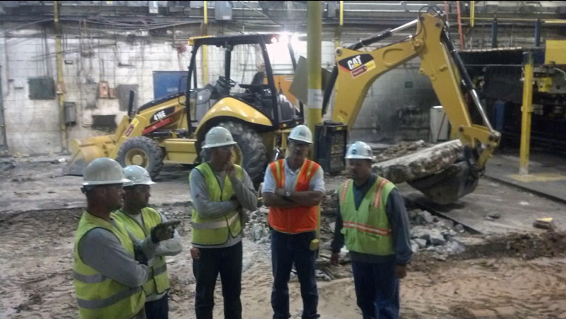 Record crew working a plant floor placement