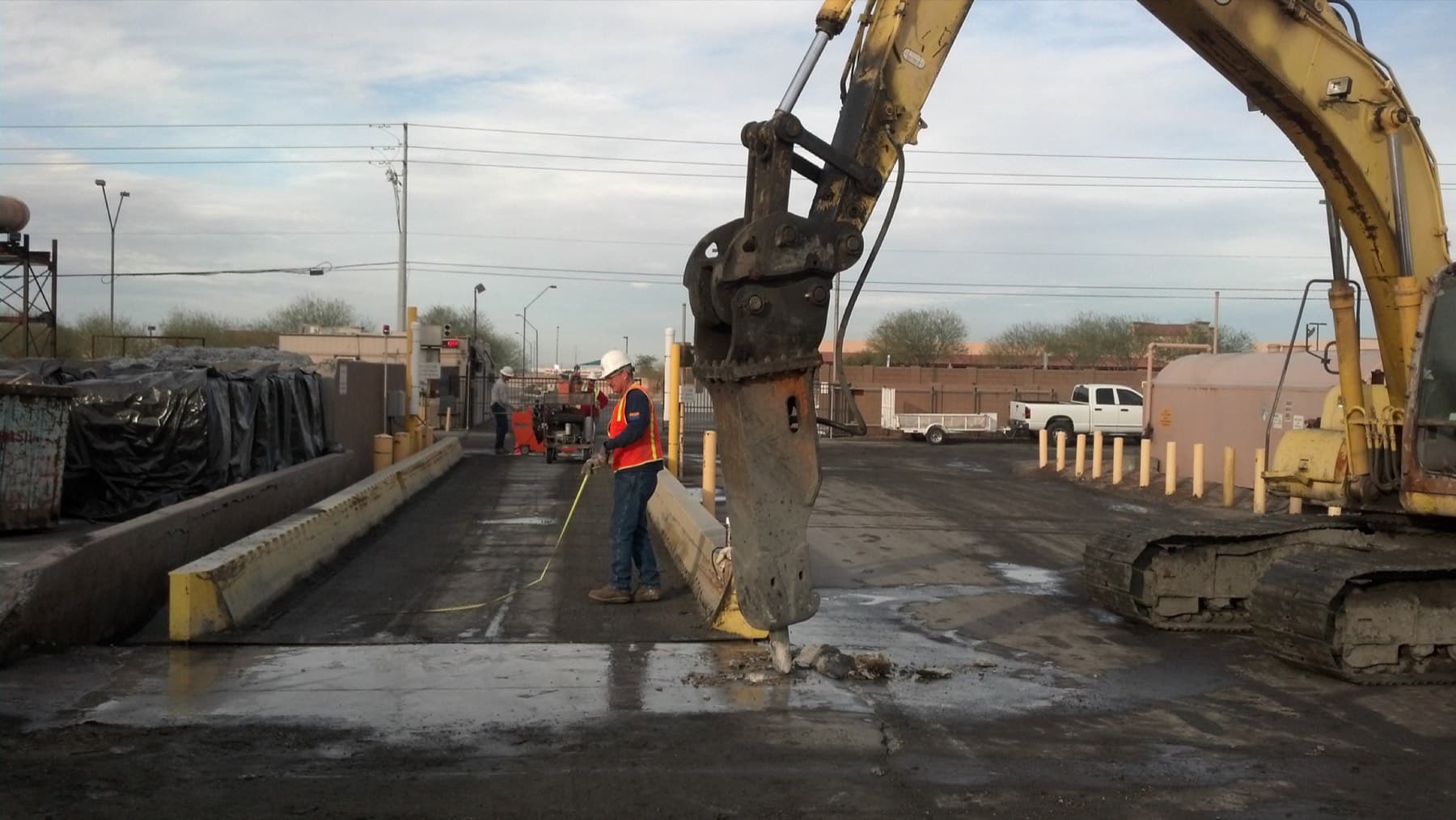 Hydraulic hammer breaking out reinforced plant floor slab