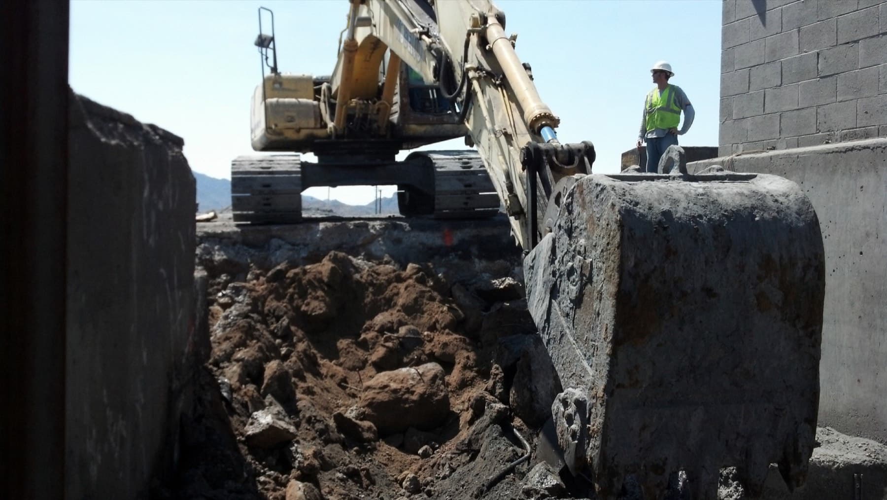 Large excavator working an industrial site excavation