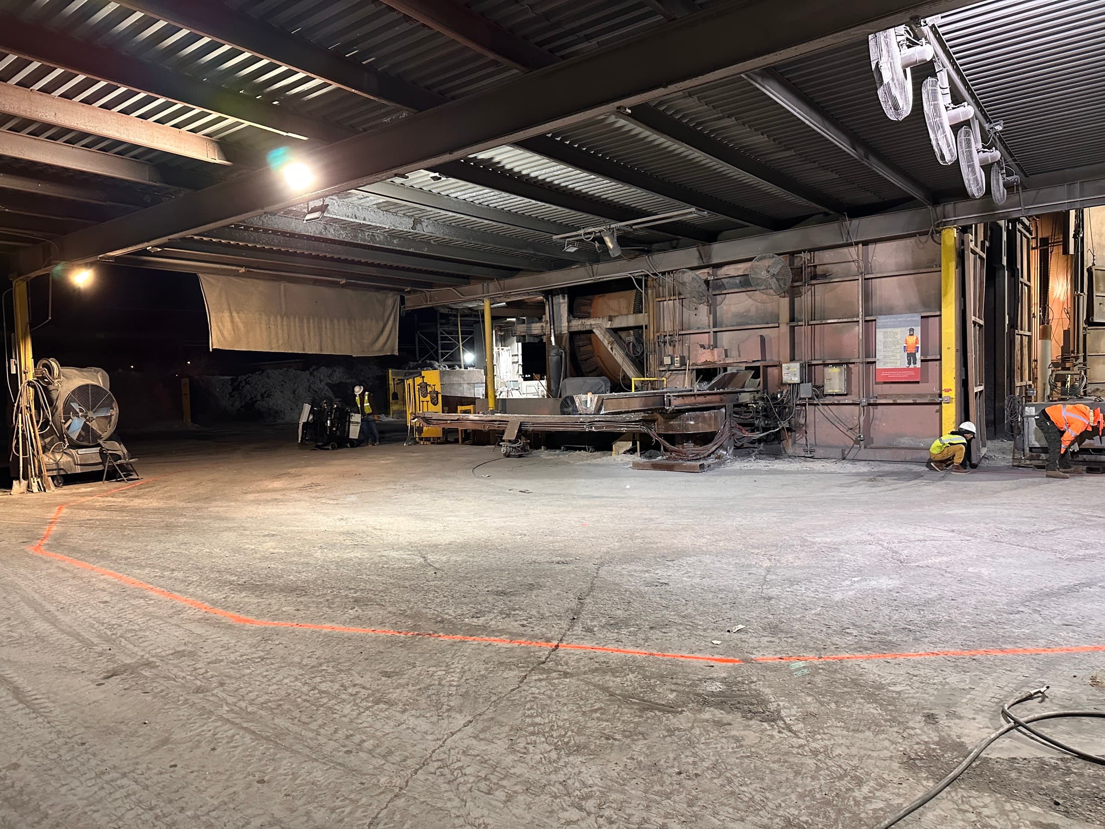 Plant floor cleared and laid out under an overhead crane, ready for demolition to start
