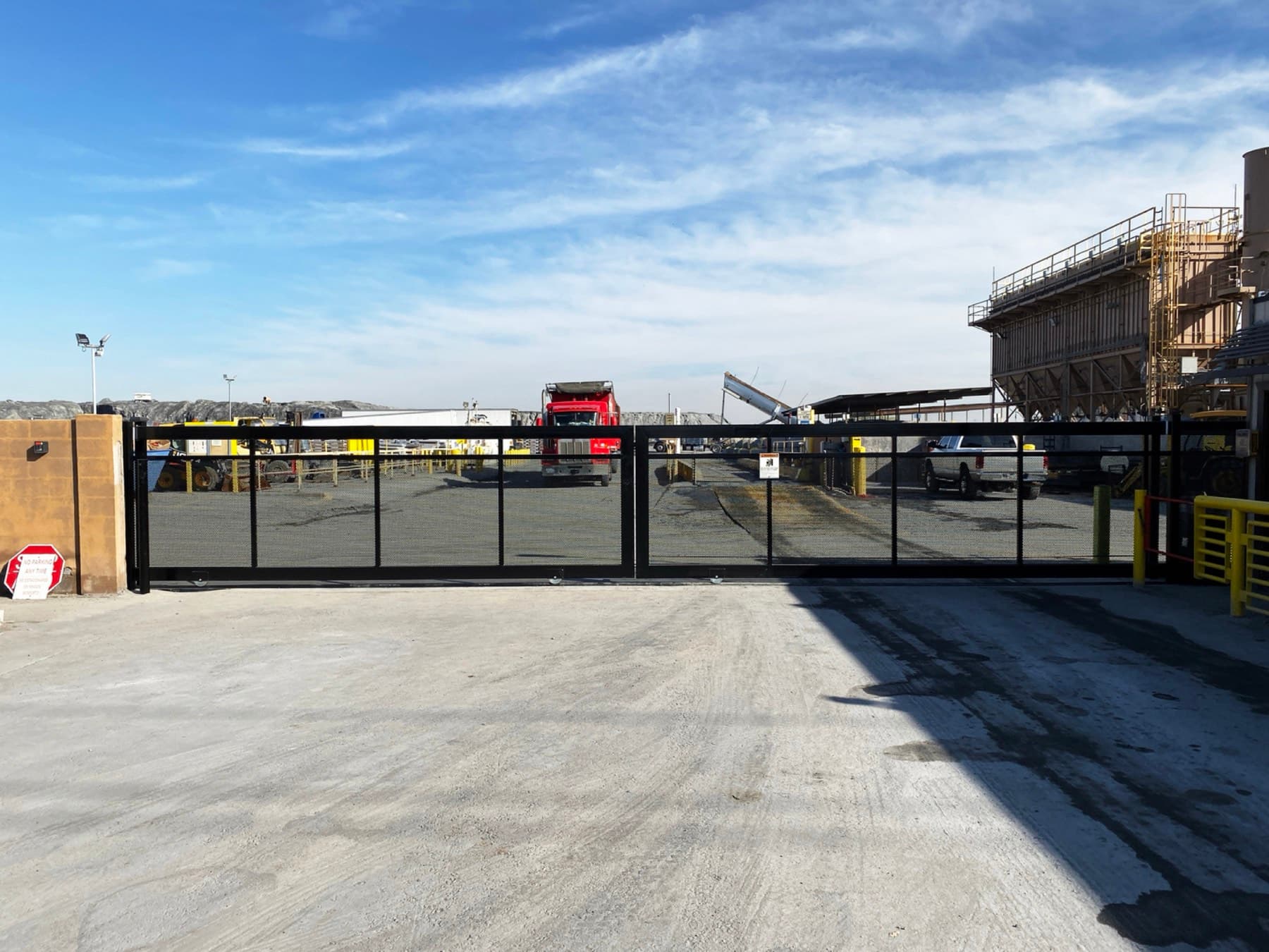 Industrial rolling entrance gate installed and operating