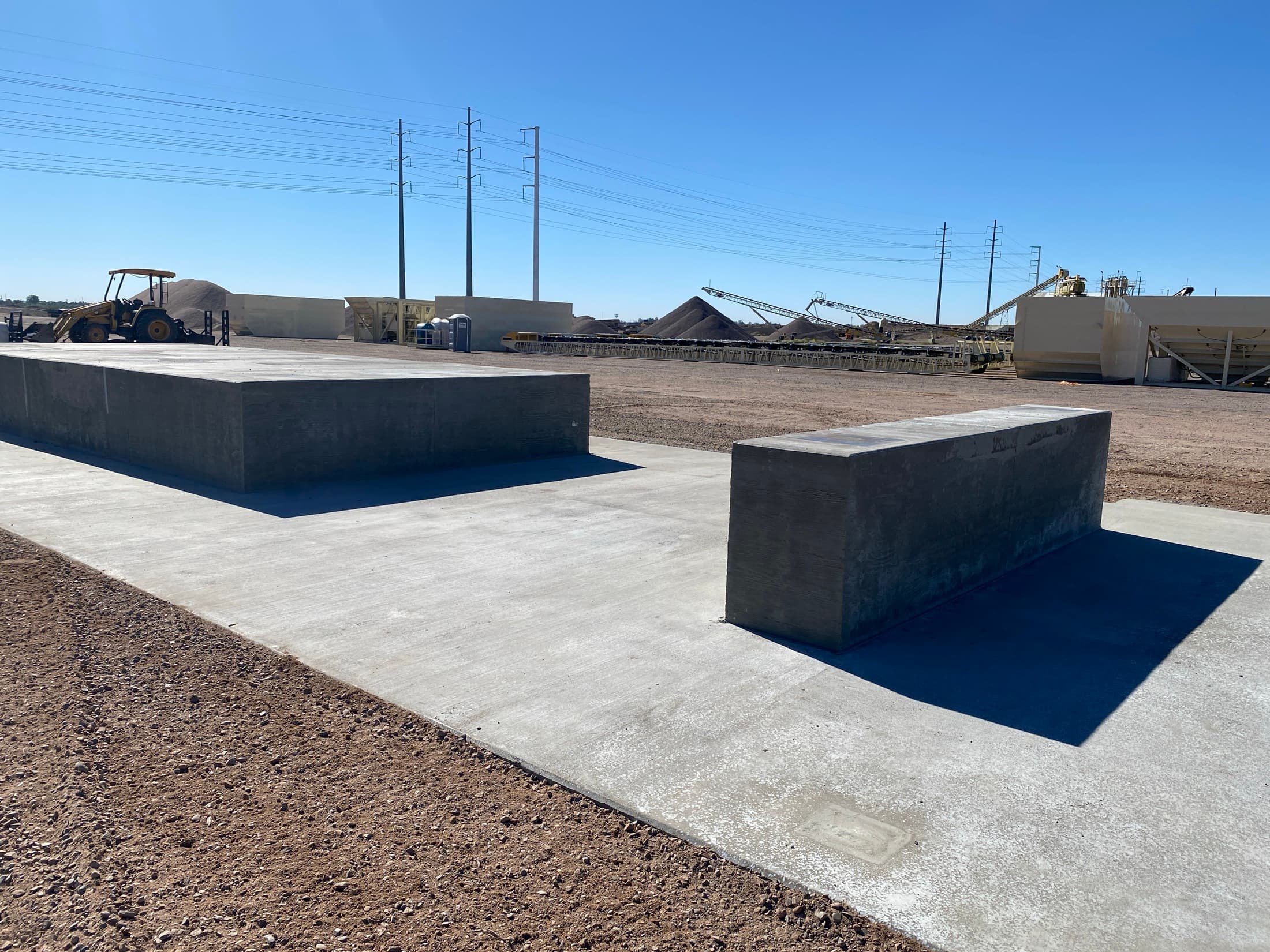 Two completed six-foot-thick ready-mix plant foundations at an aggregate facility
